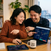 Japanese couple happily managing digital investments together